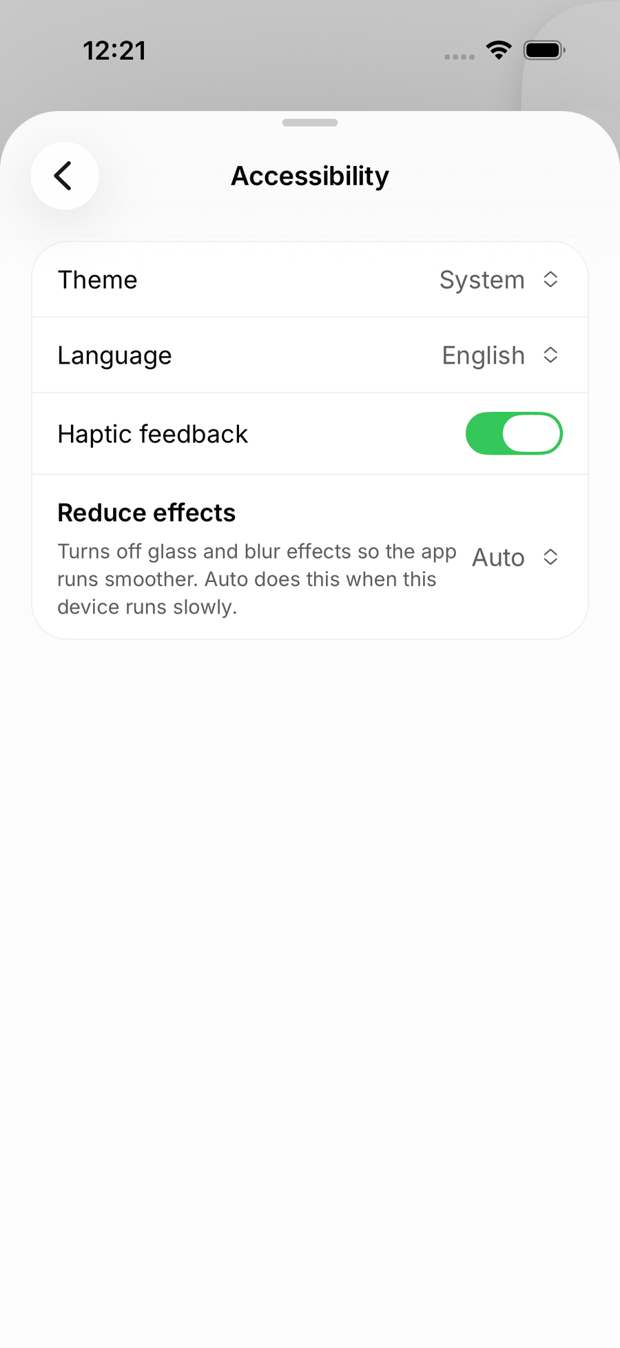 Accessibility settings in the iOS app with the Theme, Language, Haptic feedback and Reduce effects rows